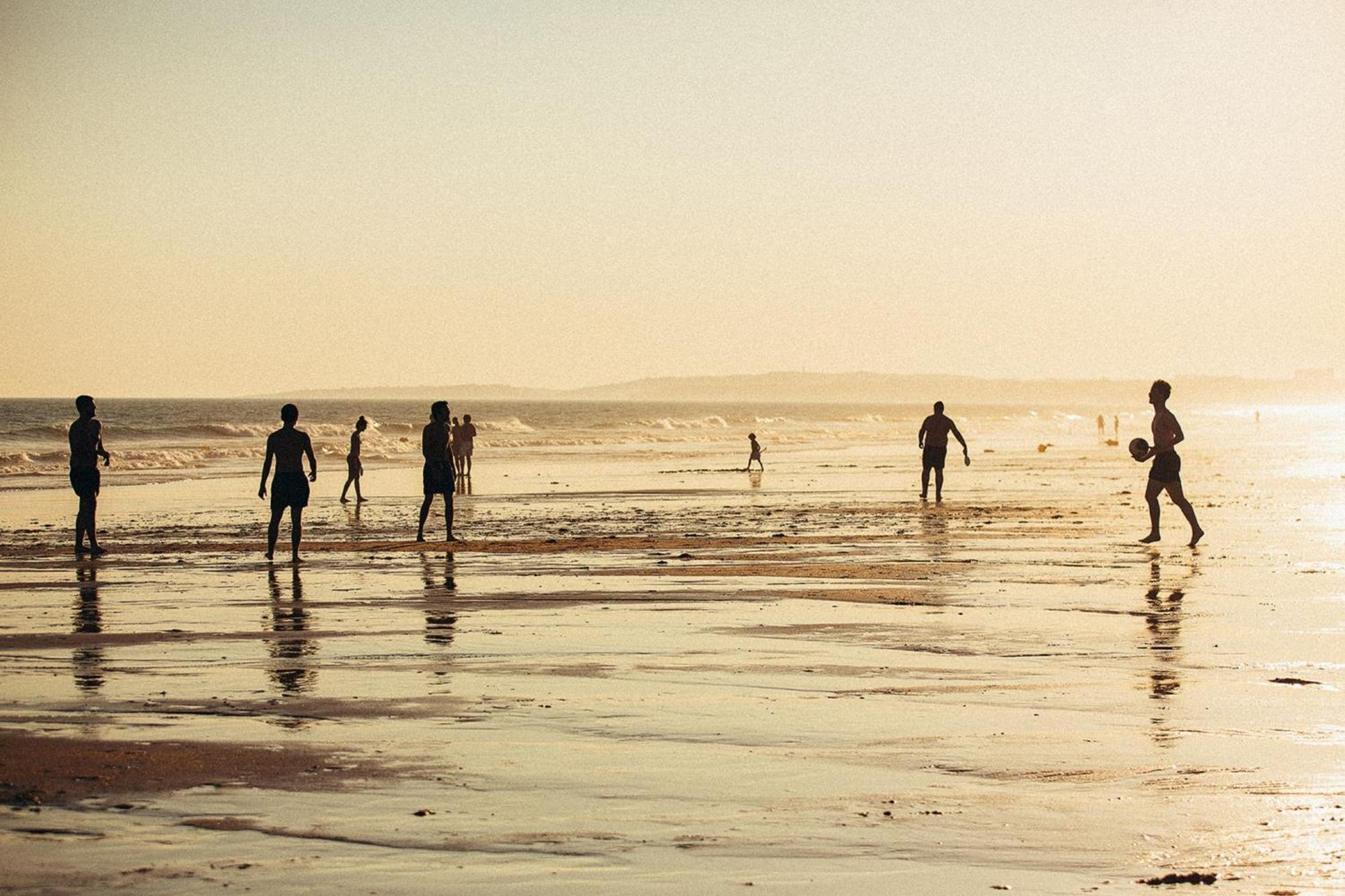 Domes Lake Algarve, Autograph Collection Виламура Экстерьер фото Children playing football on the beach